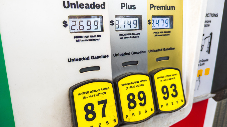 A gas station pump interface showing the price difference between regular and premium gasoline.