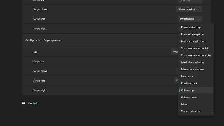 A dropdown menu in Windows 11 settings highlighting the Volume up option for touchpad swipes.