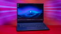 Alienware 16 Area-51 gaming laptop with illuminated keyboard and back logo.