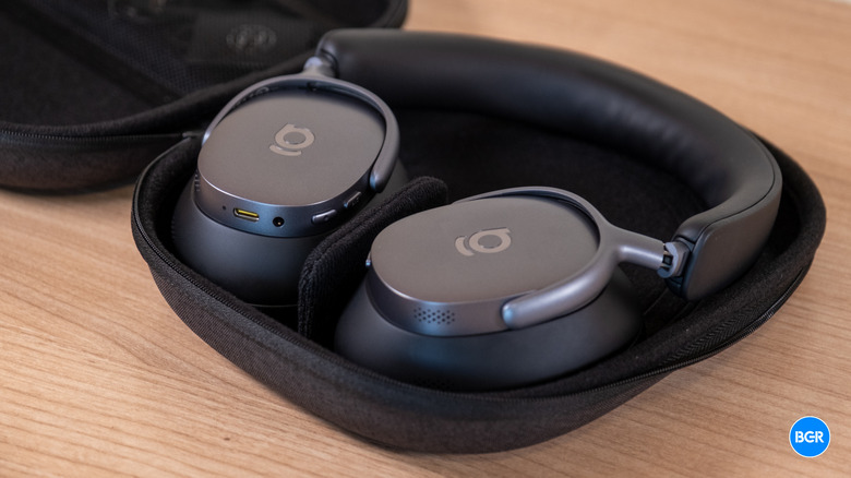 The Baseus XH1 headphones neatly folded inside their compact carrying case.