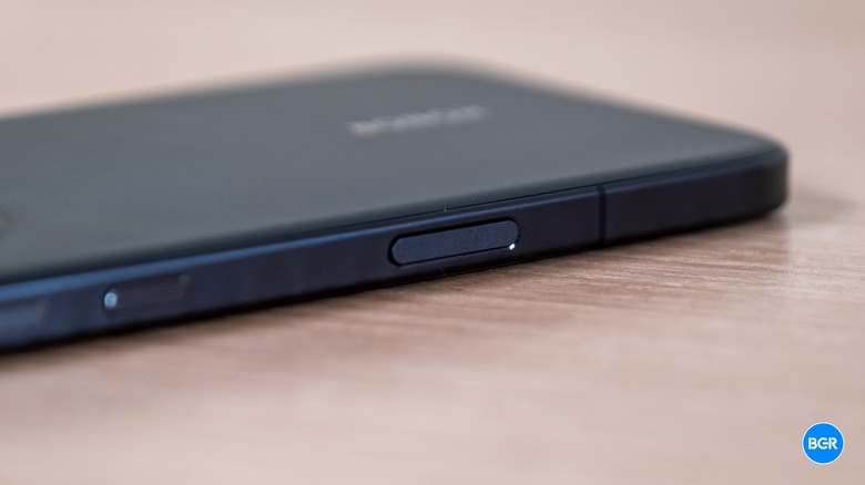 Detailed shot of the dedicated AI button on the side of the Honor Magic8 Pro.