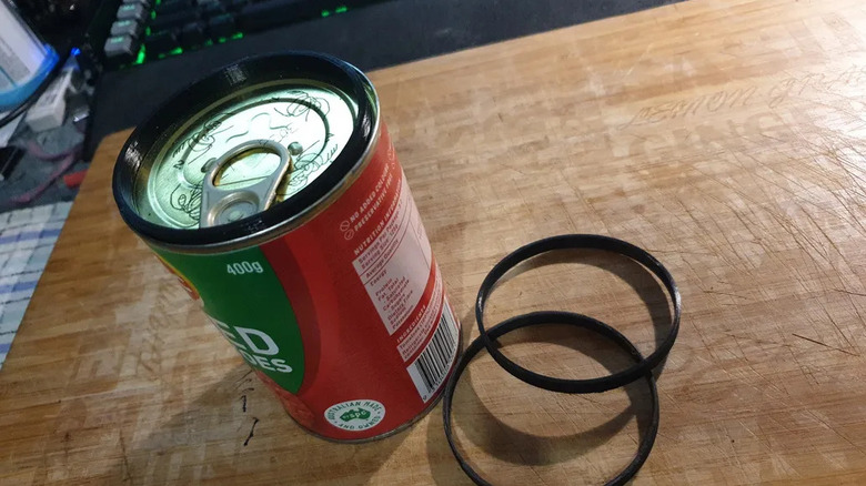 Canned food items stacked vertically using 3D printed plastic connector rings.