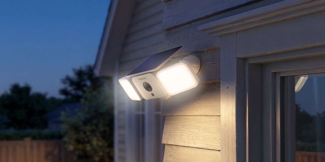 Close-up of the Reolink 2K solar security camera featuring motion-activated floodlights and weather-resistant housing.