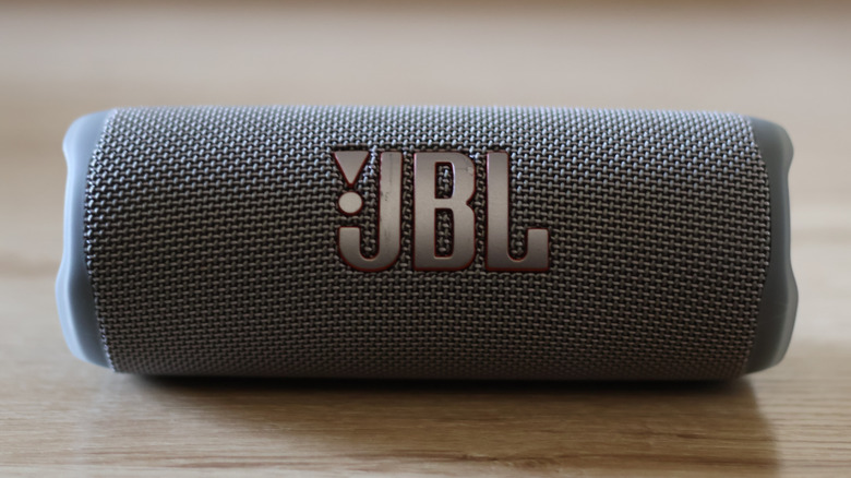 Close-up view of a JBL portable speaker's rugged fabric housing and interface.