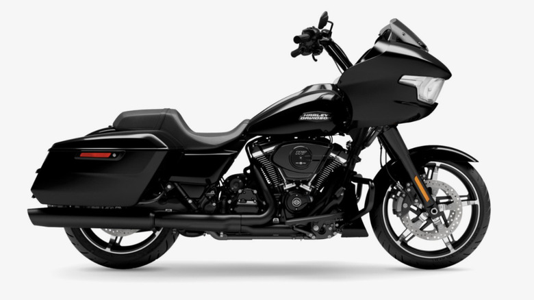 A black Harley-Davidson Road Glide with a large integrated TFT touchscreen.