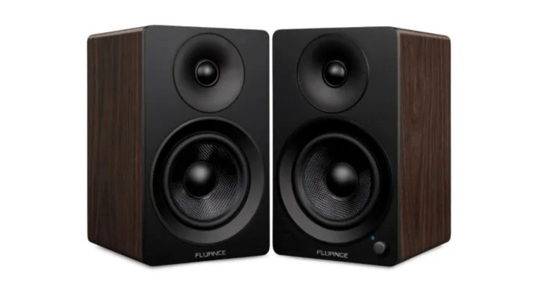 The Fluance Ai41 bookshelf speakers on a desk.
