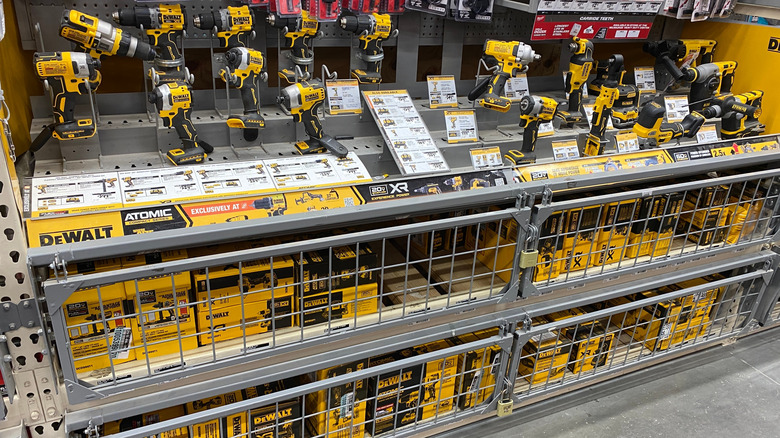 The DeWalt power tool section inside a Home Depot store with yellow branding visible.