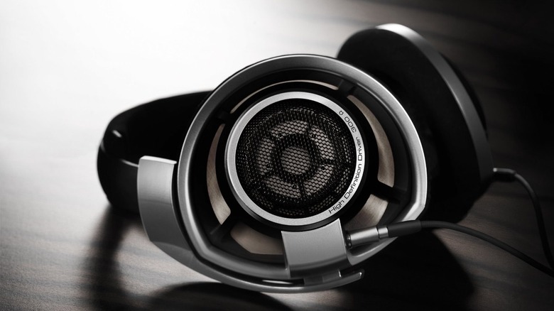 Sennheiser HD 800 S headphones with large 56mm drivers on a wooden table.
