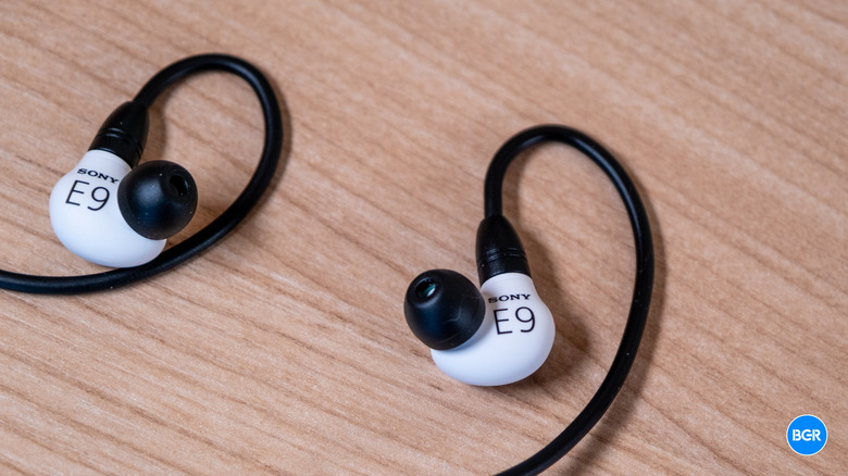 Detailed view of the Sony Inzone E9 earbuds showing the ear-hook and driver housing.