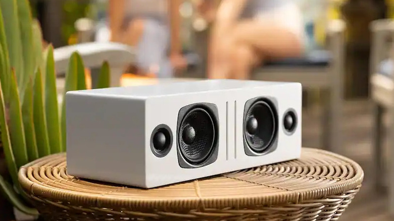 An Audioengine B2 wireless speaker in a wood finish.