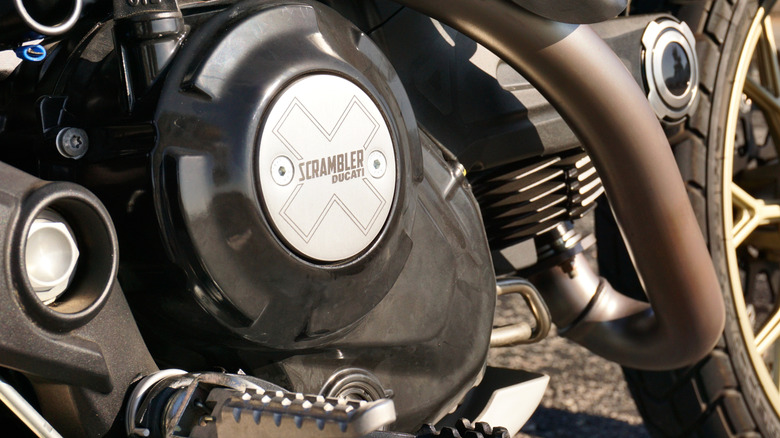 Detail shot of the 803cc L-Twin engine and side covers of the 2025 Ducati Scrambler.