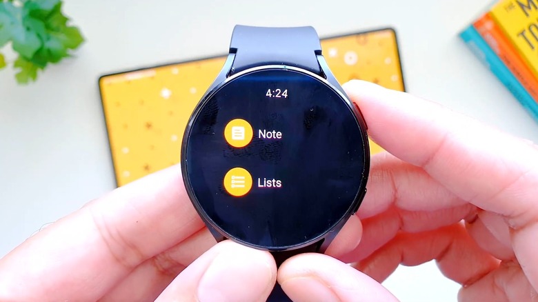 Android smartwatch displaying the Google Keep home screen with 'plus' and 'list' icons.