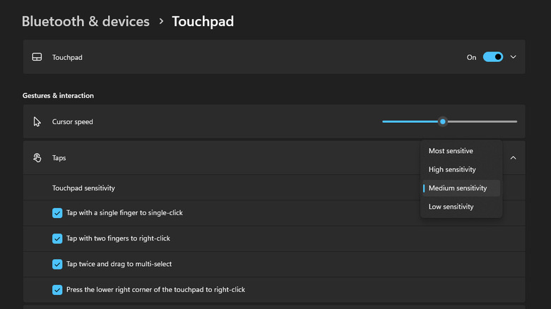 Screenshot of Windows 11 Taps sub-menu showing cursor speed slider and sensitivity dropdown.