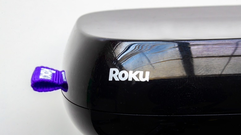 A side view profile of a Roku streaming player device.