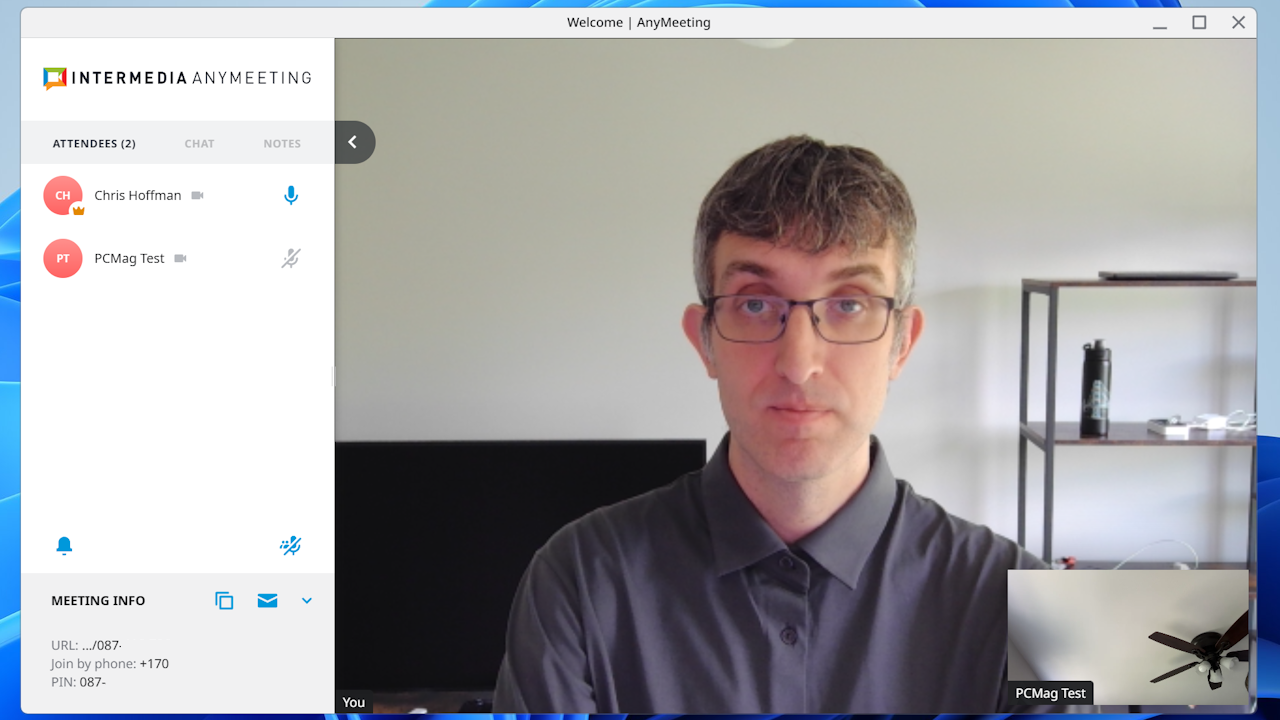 Interface showing multiple video streams and attendees in an active Intermedia AnyMeeting session.