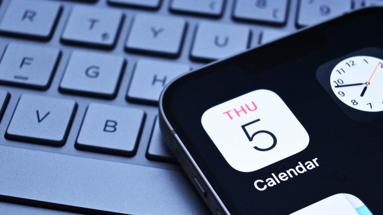 Close-up detail of the Apple Calendar icon on an iPhone screen.
