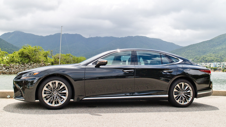 Side profile of a black 2018 Lexus LS 500 luxury sedan.