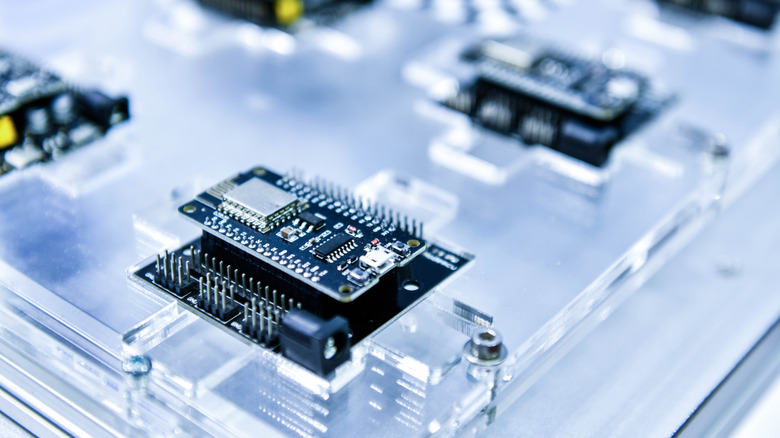 Close-up of a high-tech computer processor production line showcasing intricate electronic components.