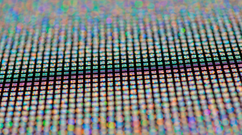 Microscopic close-up of the organic light-emitting diode sub-pixel matrix on a modern display.