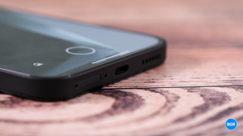 Bottom edge of the Nothing Phone 2a showing the USB-C charging port and speaker grille.