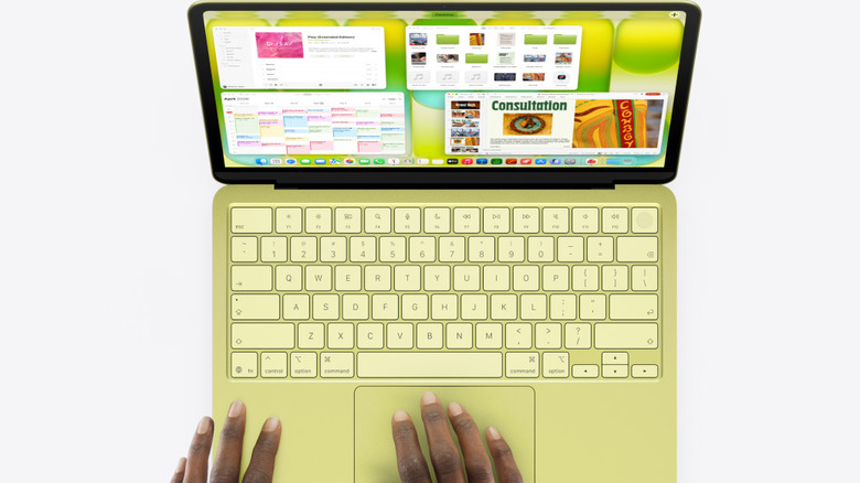 Yellow MacBook Neo with lid open on a clean white background.