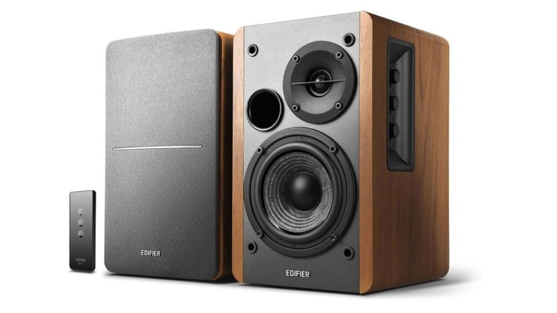 Edifier R1280T powered bookshelf speakers with a wooden finish and a small remote control.