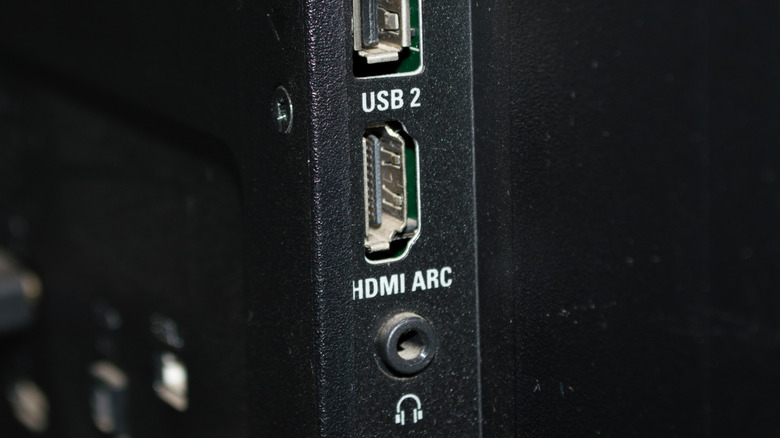 Rear view of a TV panel showing an HDMI port labeled with ARC for Audio Return Channel.