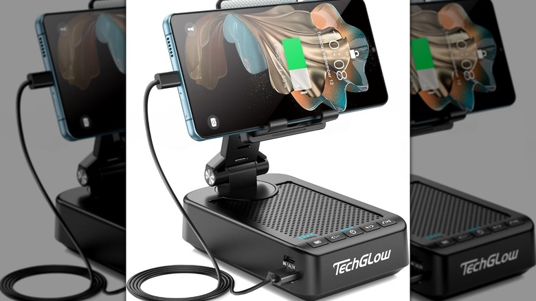 A smartphone resting on a TechGlow Foldable Cellphone Stand during a charging session.