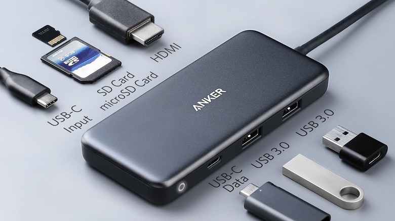 An Anker USB-C hub shown with its connected peripheral cables on a desk.
