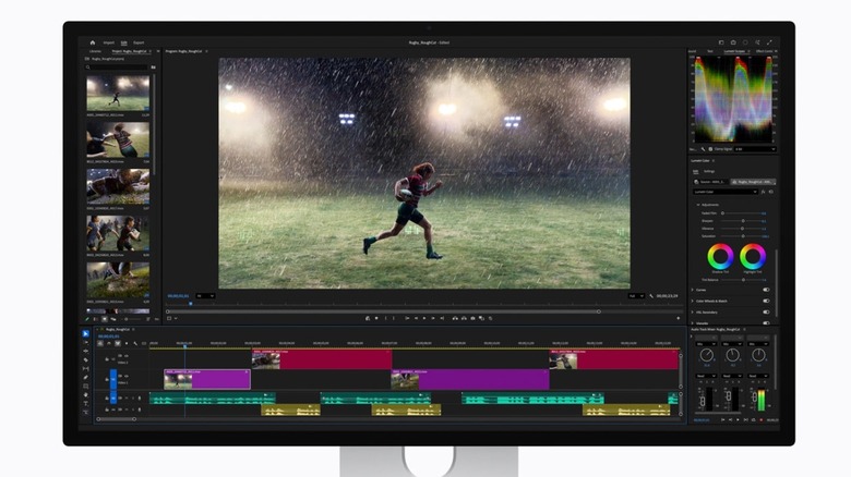 The Studio Display XDR showing a vivid, high-contrast image of a sports player in a dark, rainy environment.
