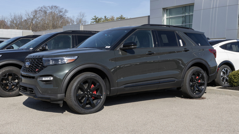 A Ford Explorer ST parked at a car dealership showing its sporty trim.