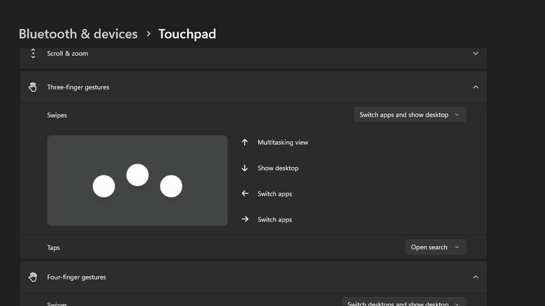 Windows 11 settings showing three-finger gestures for switching apps and showing the desktop.
