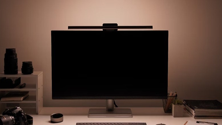 Close-up of the BenQ ScreenBar Halo 2 mounted on top of a computer monitor.
