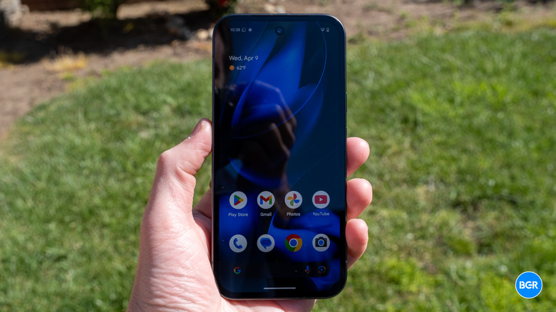 The vibrant pOLED display of the Google Pixel 9a showing the home screen.