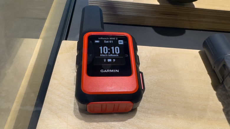 A habanero red Garmin inReach Mini 2 satellite communicator.