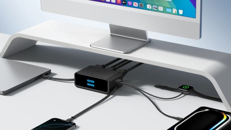 An Anker Nano Charging Station powering multiple Apple devices simultaneously on a desk.