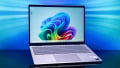 Front view of the silver Dell 14 Plus laptop open on a neutral background.