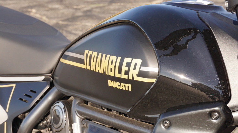 Close-up of the 2025 Ducati Scrambler tank with modern graphic decals.
