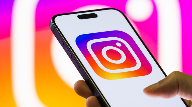 A zoomed-in view of the Instagram logo on a mobile device.