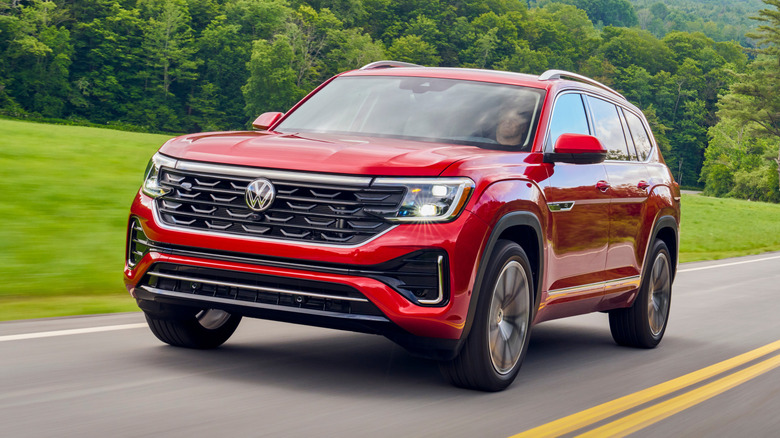 A Volkswagen Atlas driving at high speed on an open highway.