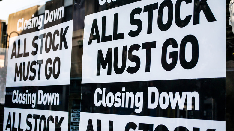 A business window sign that reads Closing Down, All Stock Must Go.
