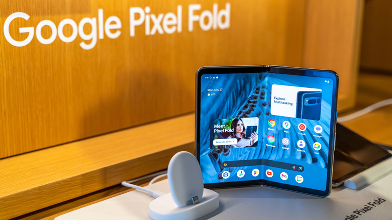 The original Google Pixel Fold on a white display stand inside a store.