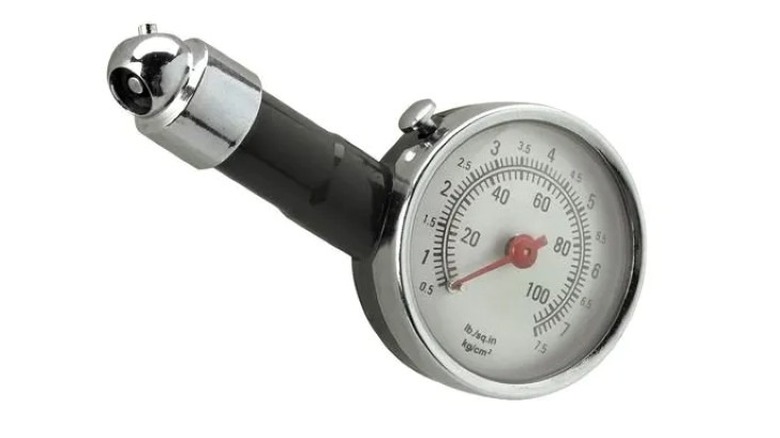 An analog tire pressure gauge with a circular dial and black rubber hose.