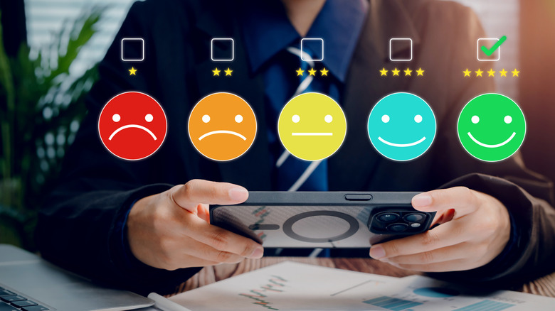 Holographic emoji ratings and data symbols used for product testing visualization.