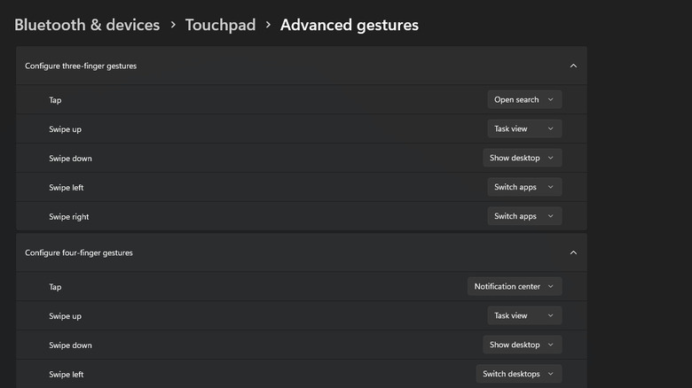 Advanced gestures interface in Windows 11 showing three and four-finger configuration options.