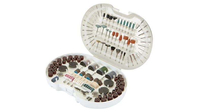 A Warrior brand rotary tool accessory set with various sanding, cutting, and polishing bits.