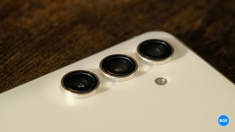 Detail shot of the triple-lens camera array on the back of the Samsung Galaxy S24.