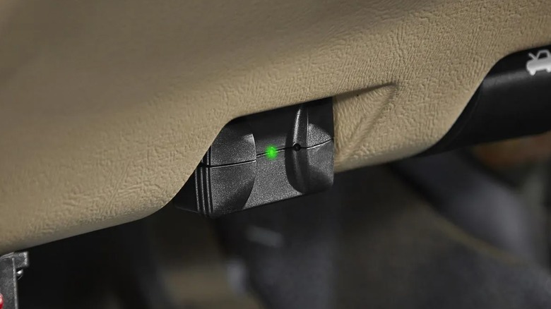 The Zurich ZR-BT1 Bluetooth OBD2 code reader dongle for vehicle diagnostics.