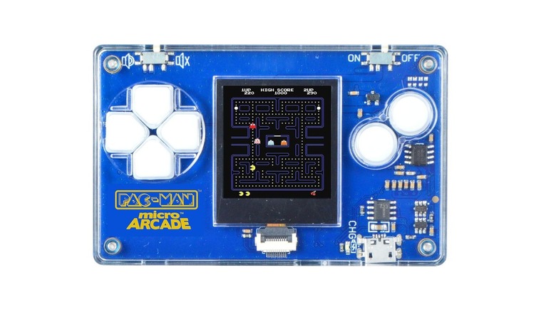 A transparent Micro Arcade Pacman keychain console showing its internal electronic circuit board.