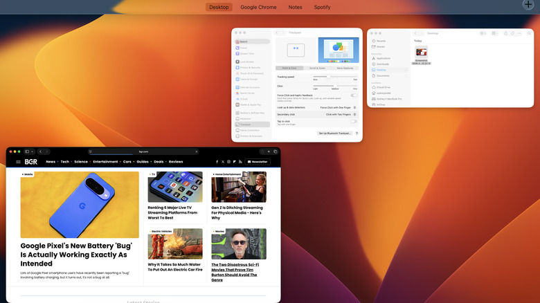 The Mission Control interface on a Mac showing several open app windows and Desktop Spaces.